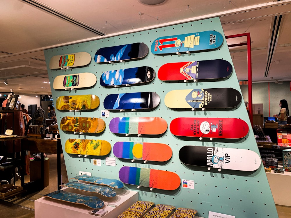 a display of skateboards on a wall in a store