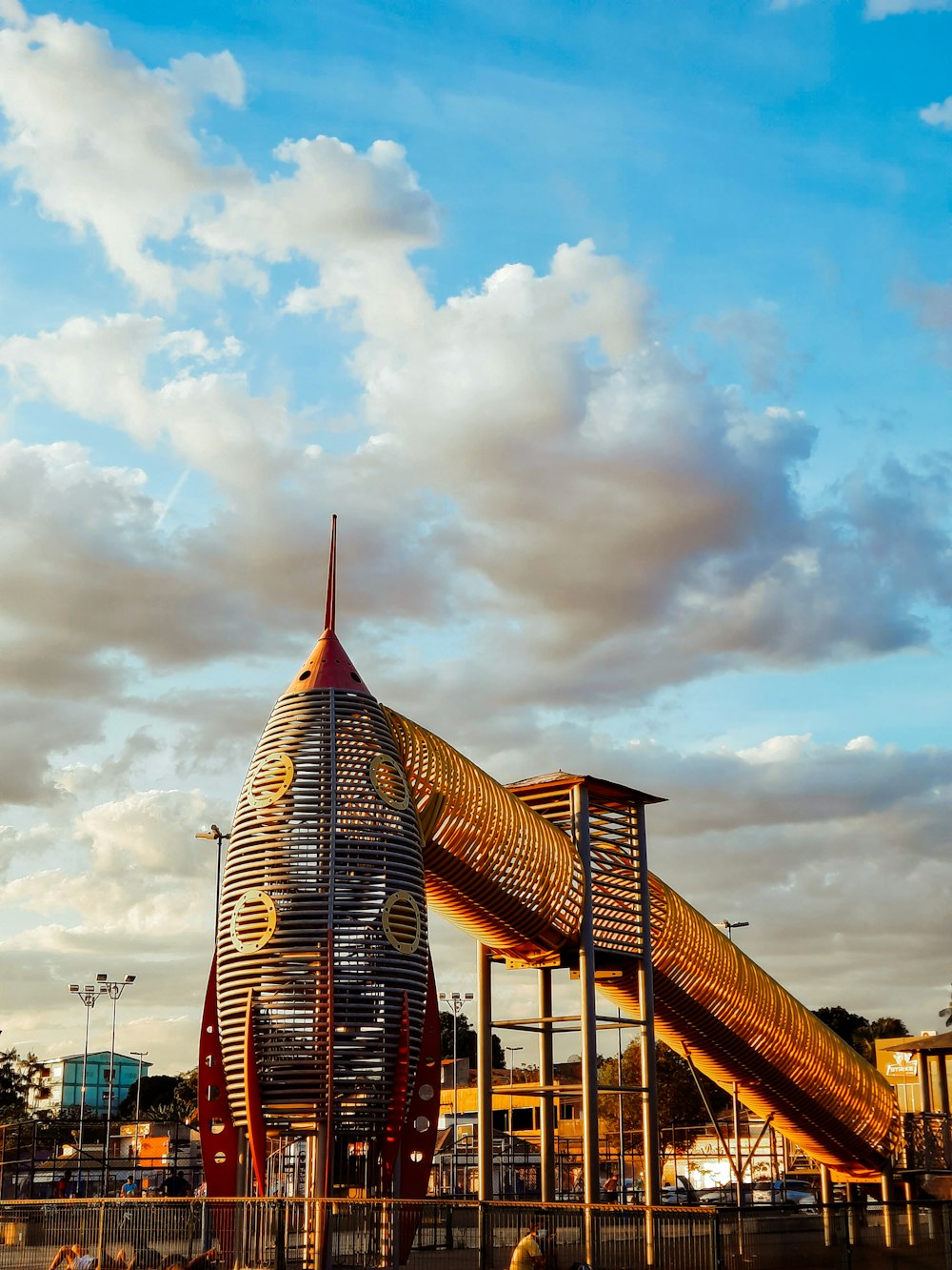 a large wooden structure with a slide on top of it