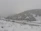 Family with children enjoying a safe and cozy transfer through snowy mountain roads.