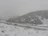 Family with children enjoying a safe and cozy transfer through snowy mountain roads.