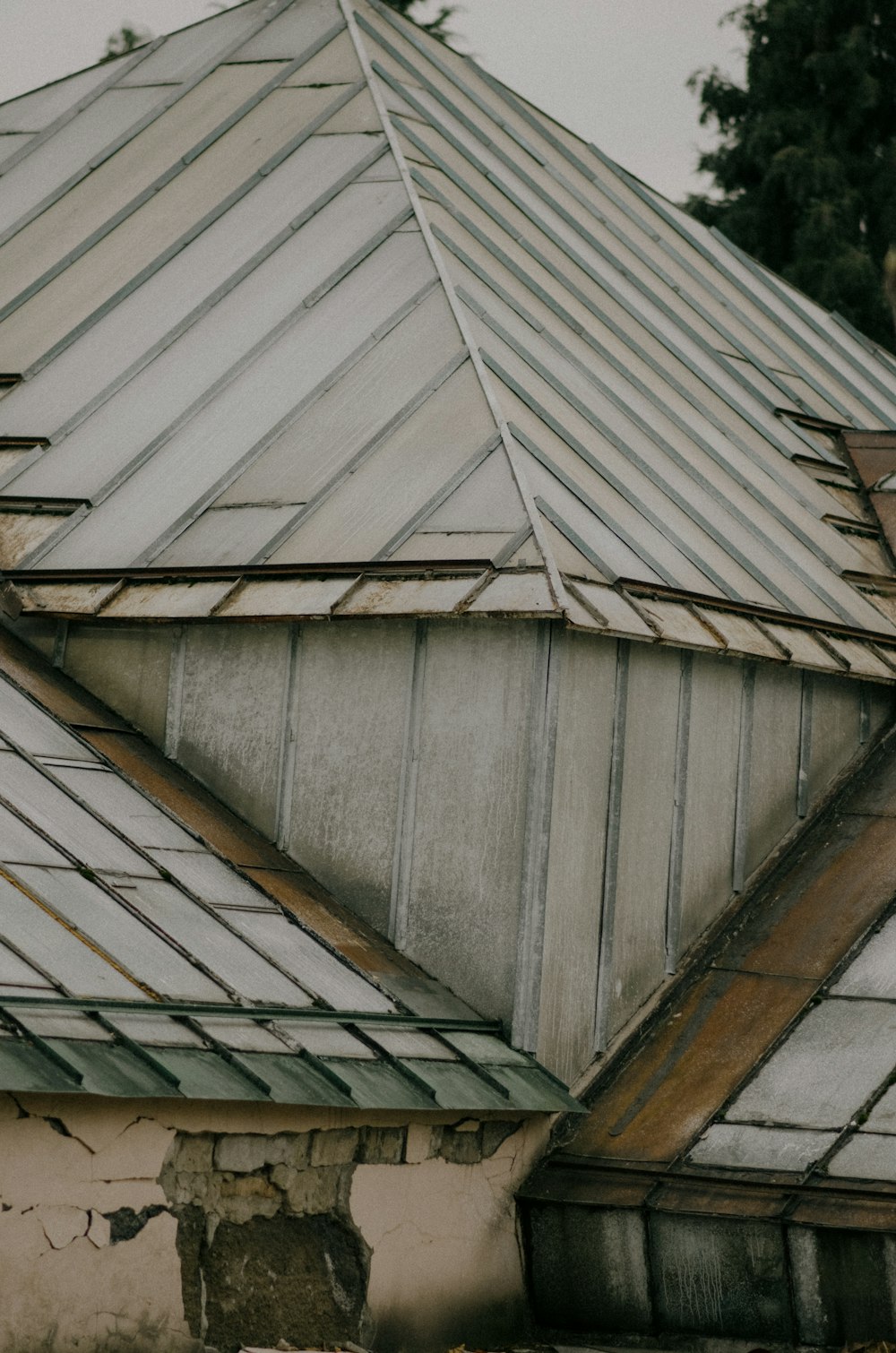 the roof of a building with a broken down roof