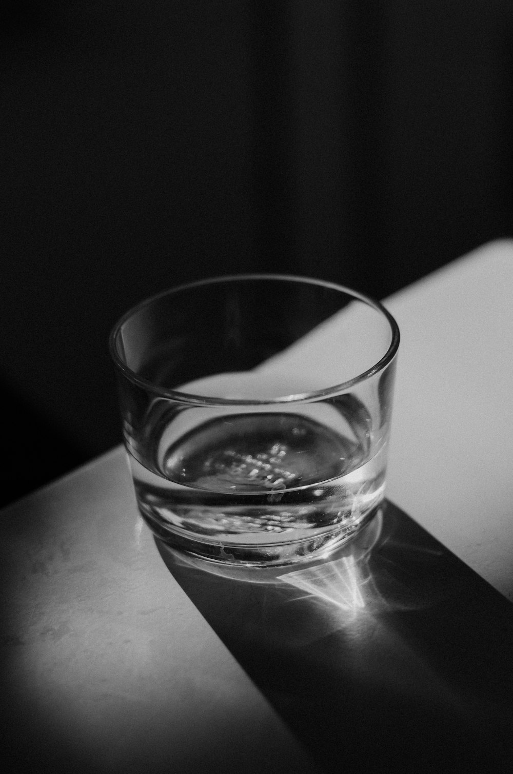 a close up of a glass cup on a table