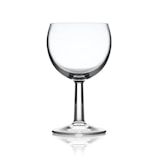 Close-up of a clear polystyrene wine glass with a smooth finish on a white background.