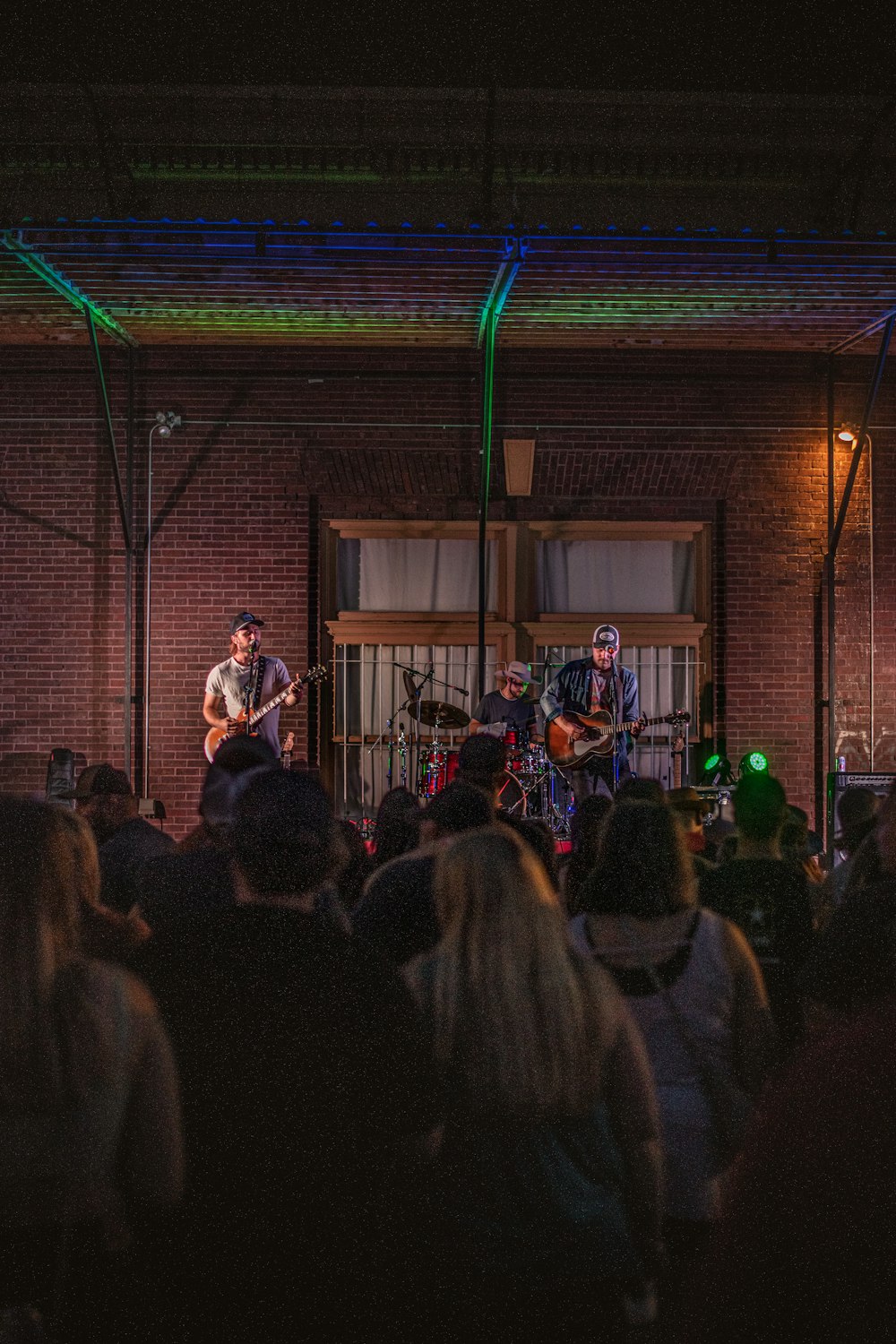 a group of people that are standing on a stage