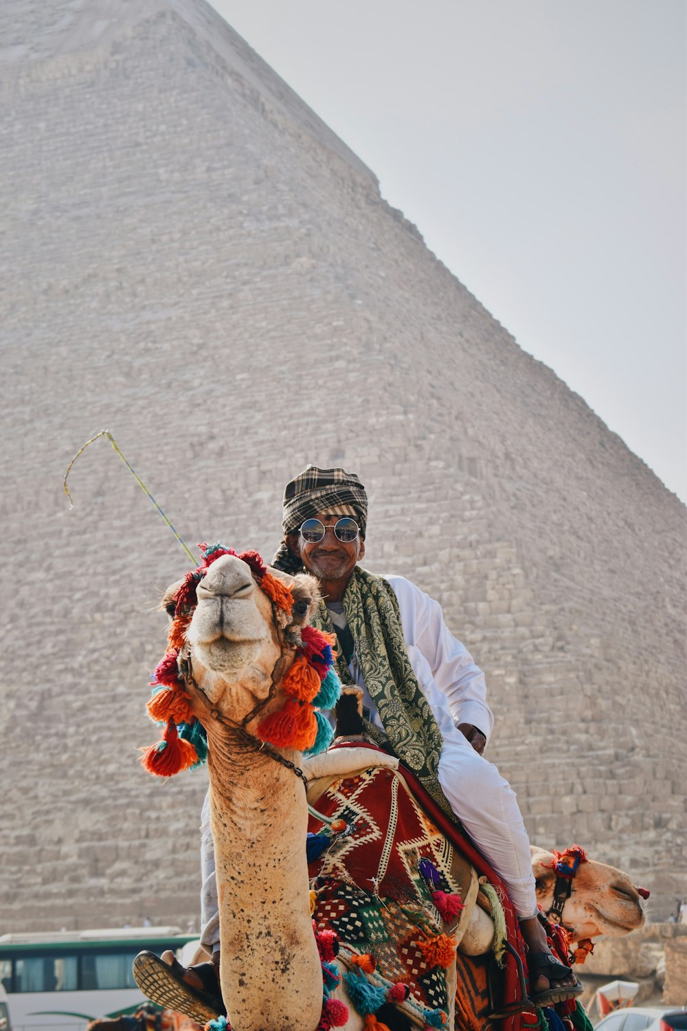 a man riding on the back of a camel
