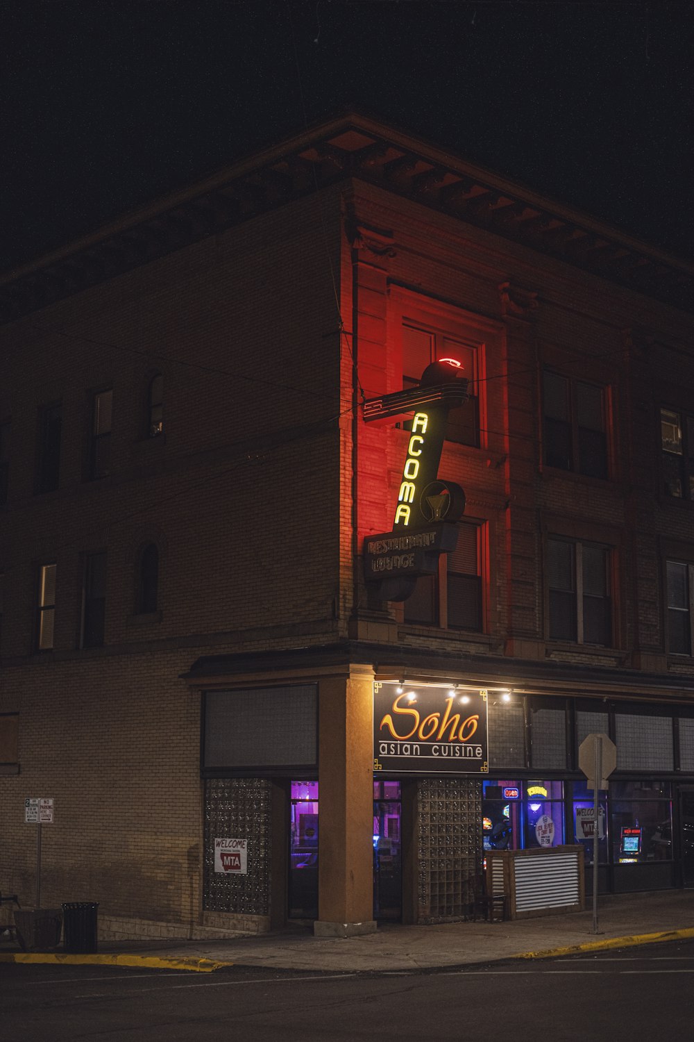 a neon sign on the side of a building