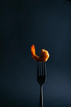 a fork that has some food on it