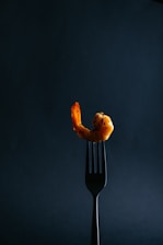 a fork that has some food on it