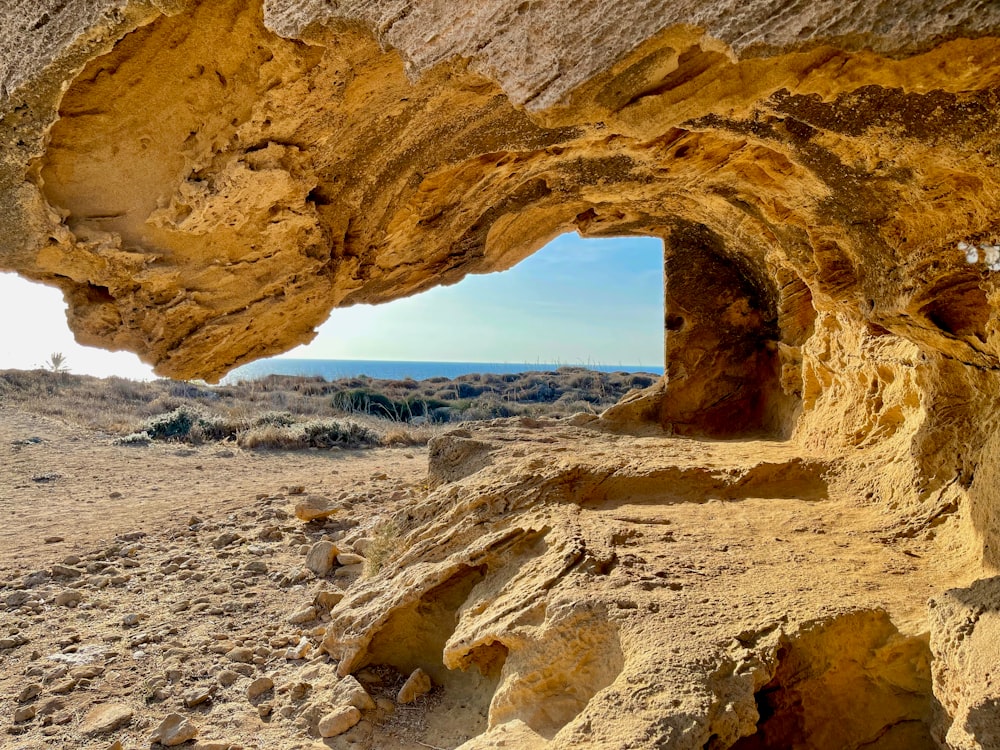 a rock formation with a hole in the middle of it