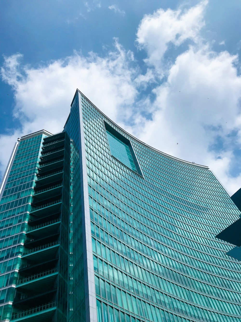 a very tall building with a sky background