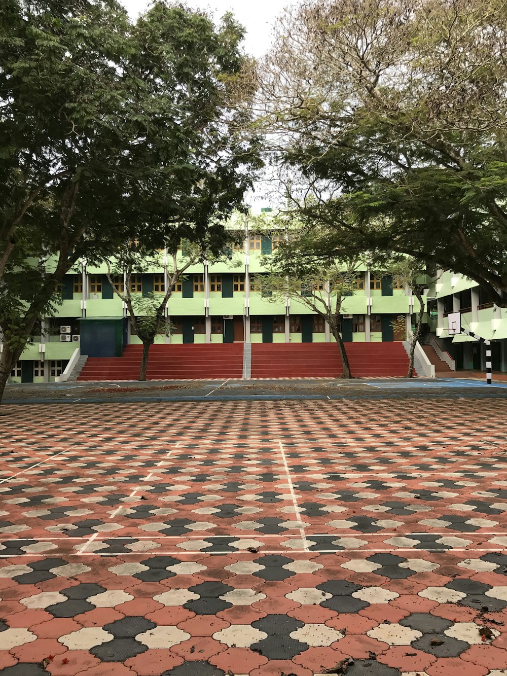 a large building with a red and white checkered floor