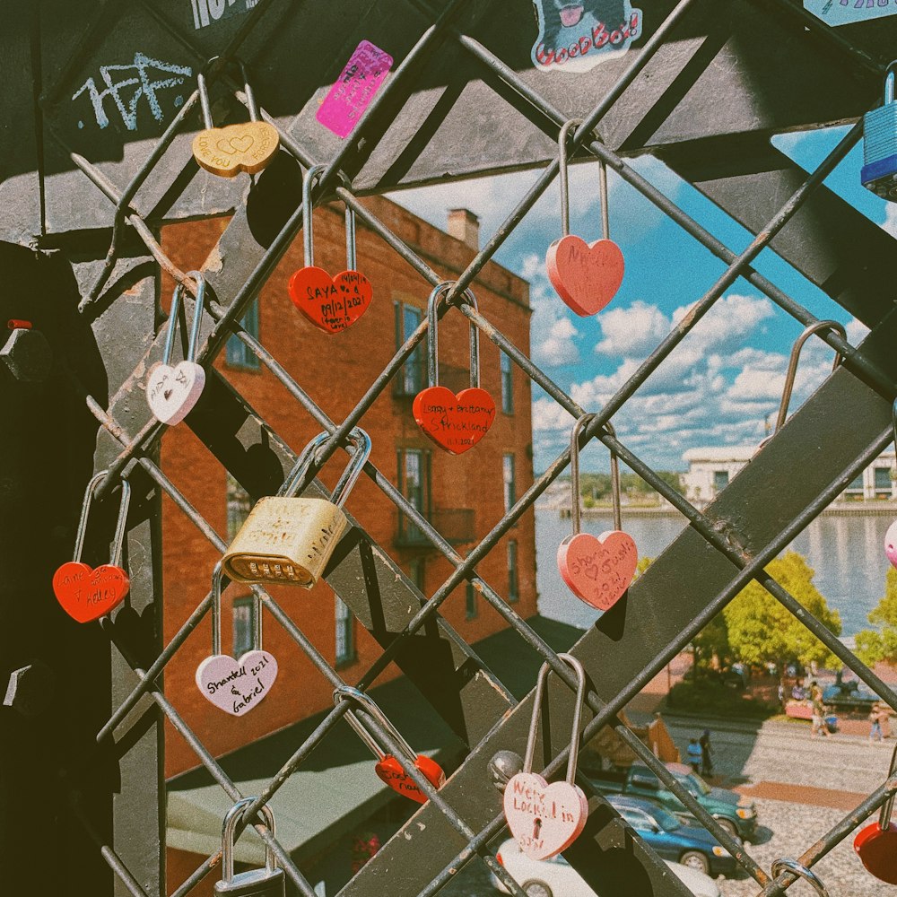a bunch of hearts attached to a fence