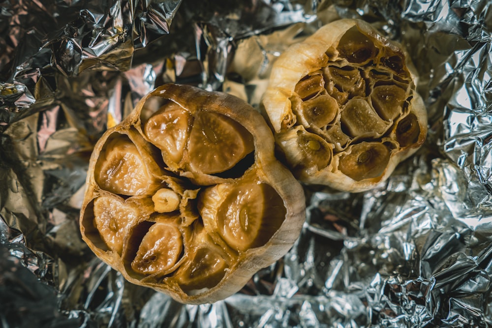 two pieces of food sitting on top of tin foil