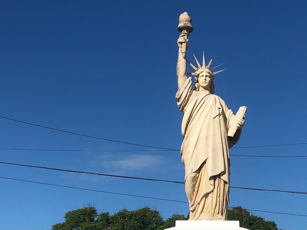 a statue of liberty holding a torch in its hand