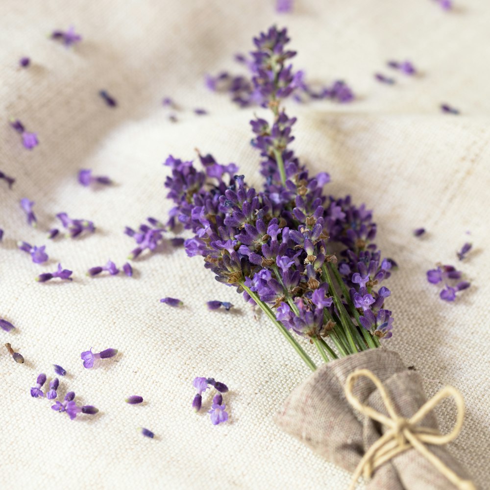 a bunch of purple flowers sitting on top of a table