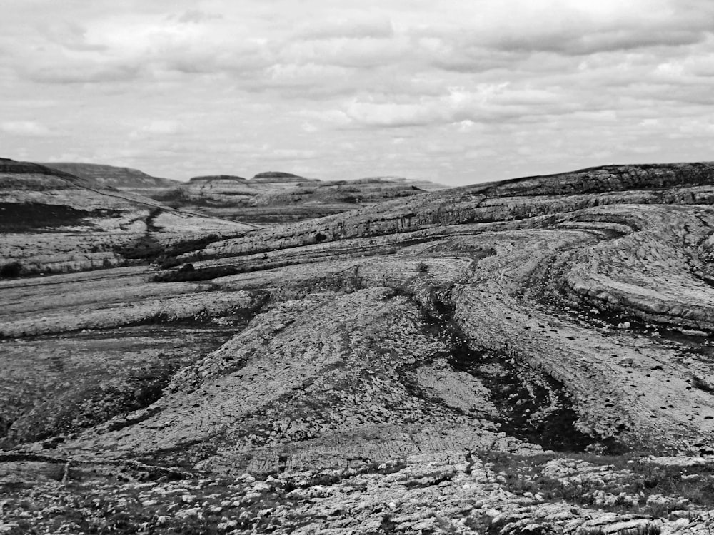 a black and white photo of a rocky landscape