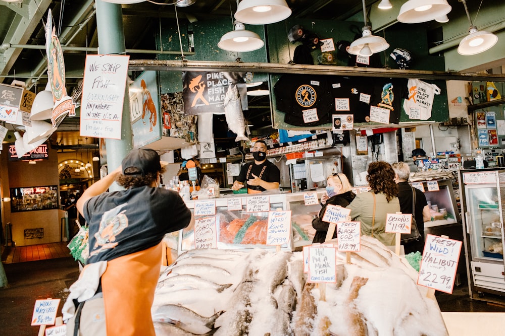 a group of people standing around a store