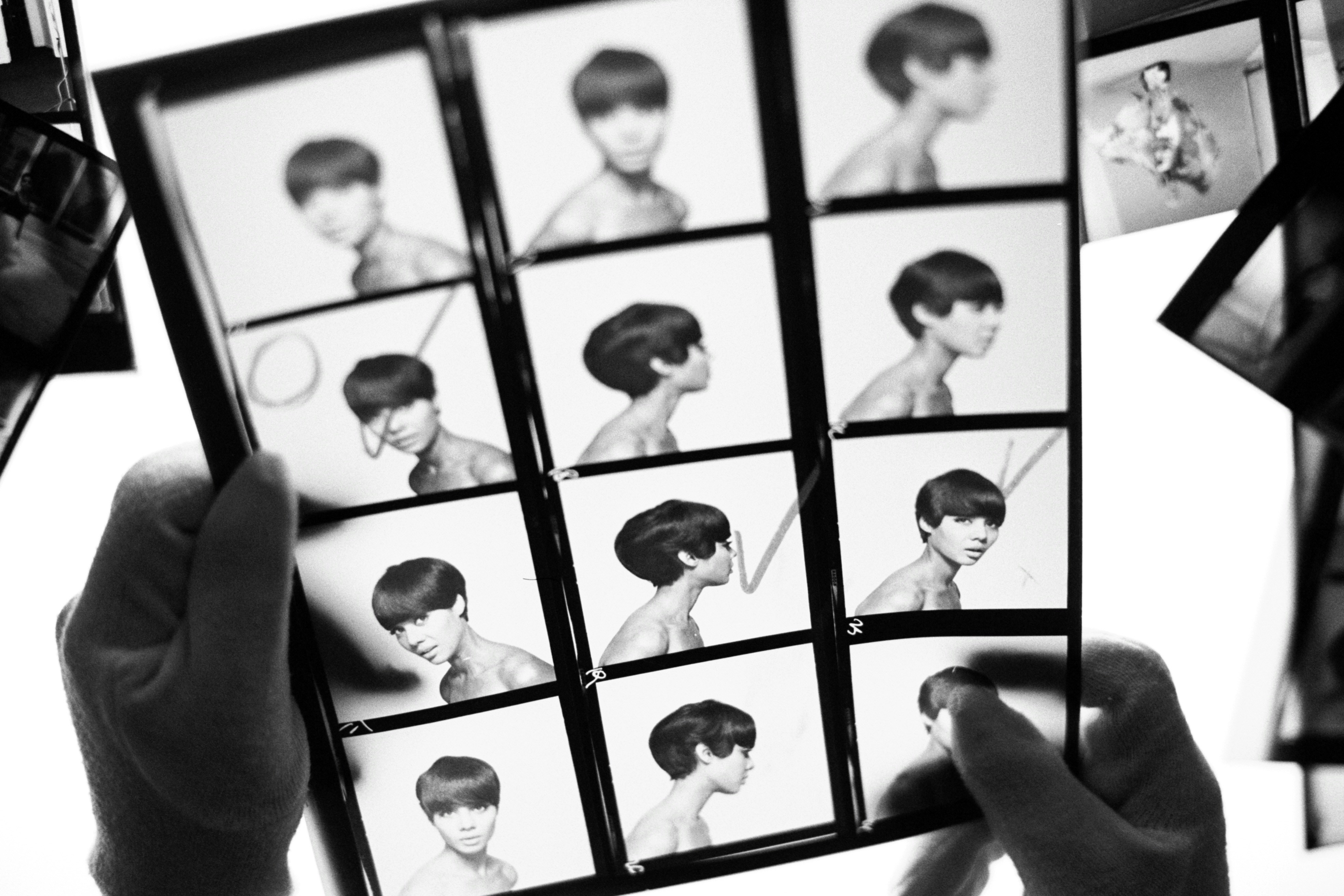 Person crafting digital AI avatar video on laptop