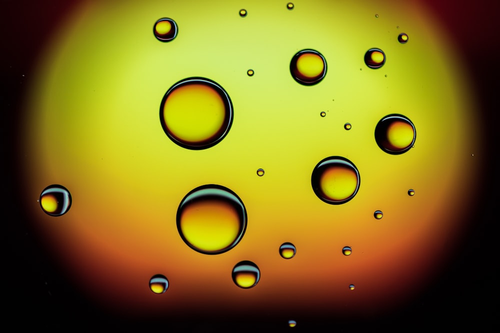 a close up of water droplets on a black background