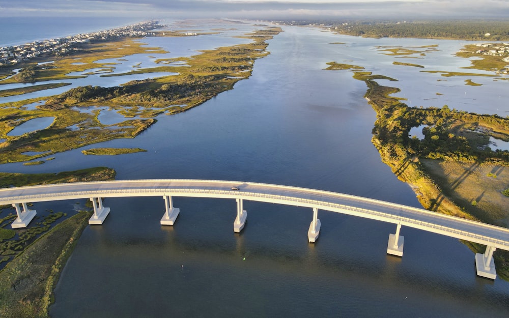 an aerial view of a bridge over a body of water