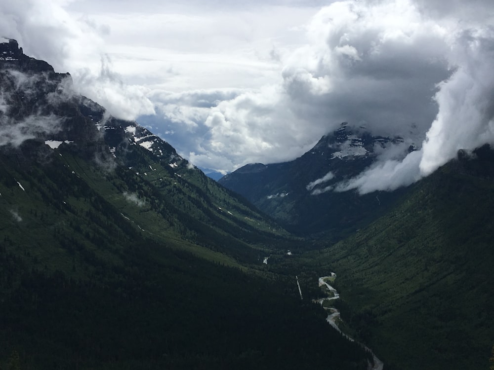 a view of a valley with a river running through it