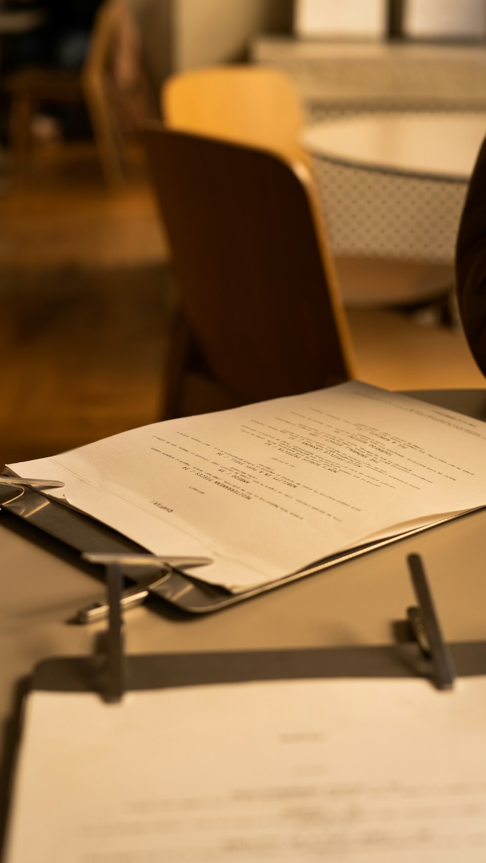 a person sitting at a table with a piece of paper on top of it