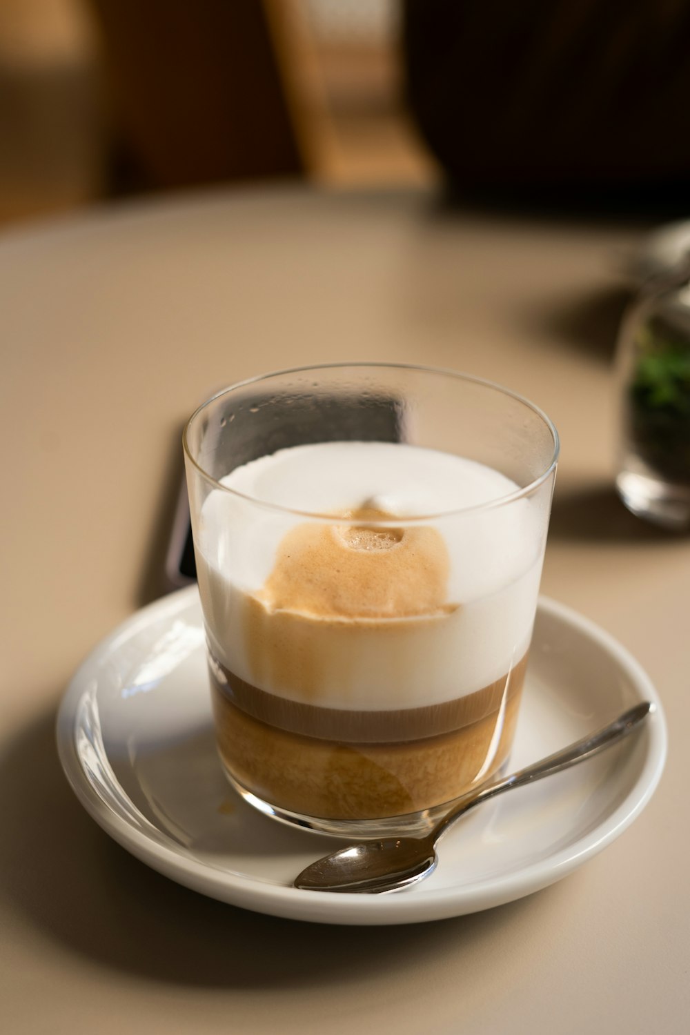 a small dessert on a plate with a spoon