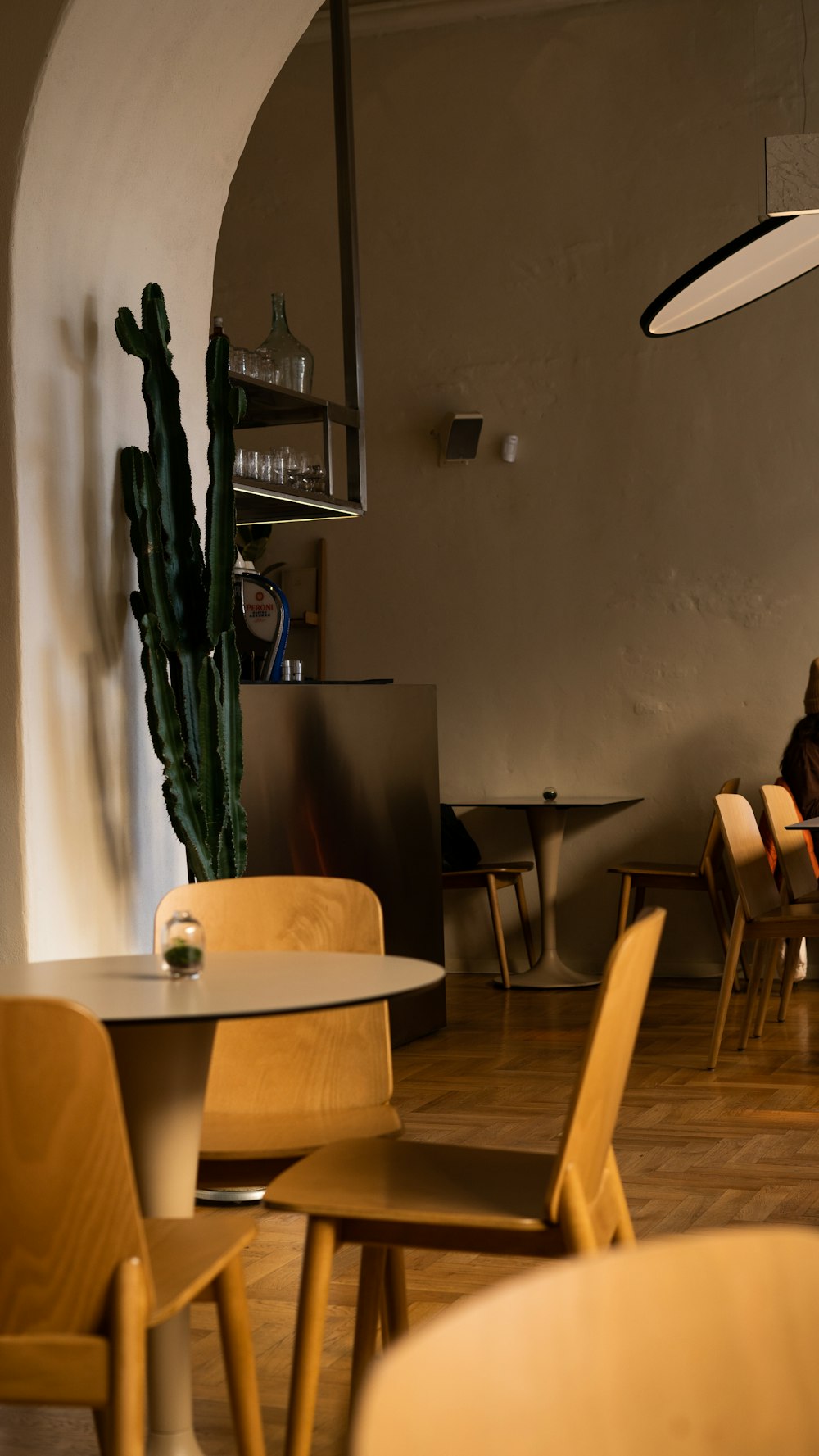 a person sitting at a table in a restaurant