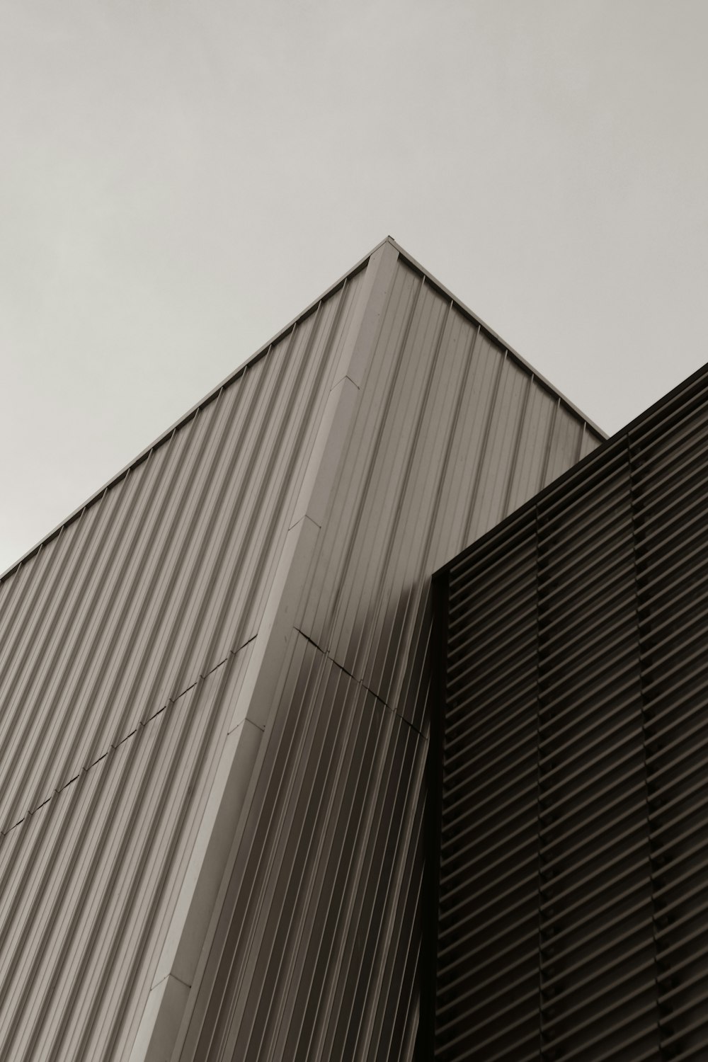 a black and white photo of the side of a building