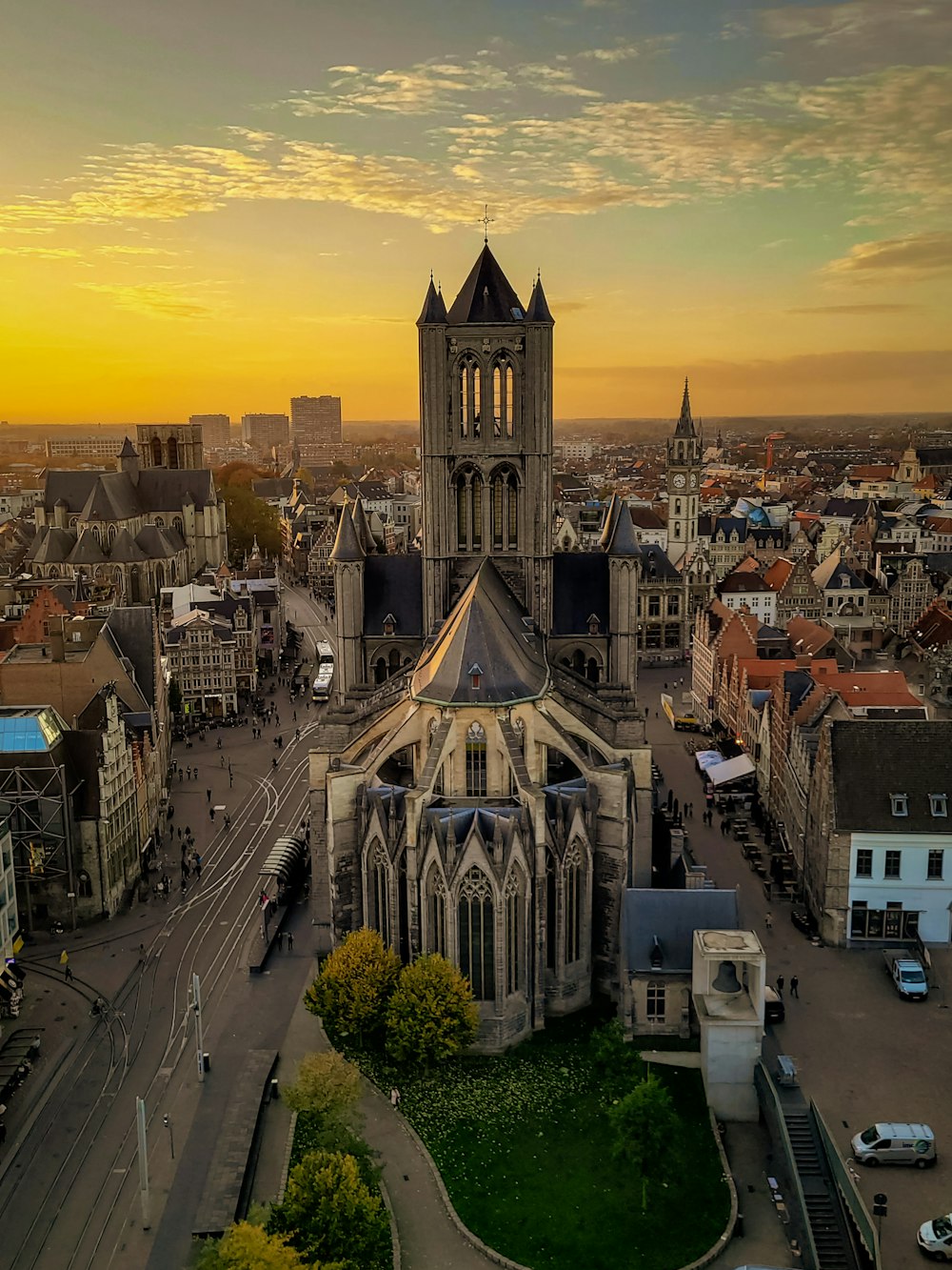 an aerial view of a city at sunset