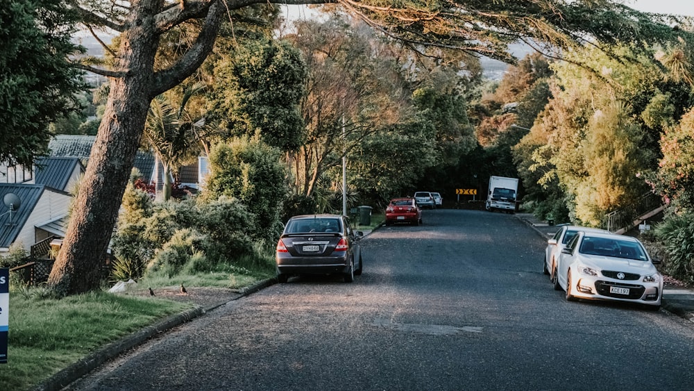 a couple of cars parked on the side of a road