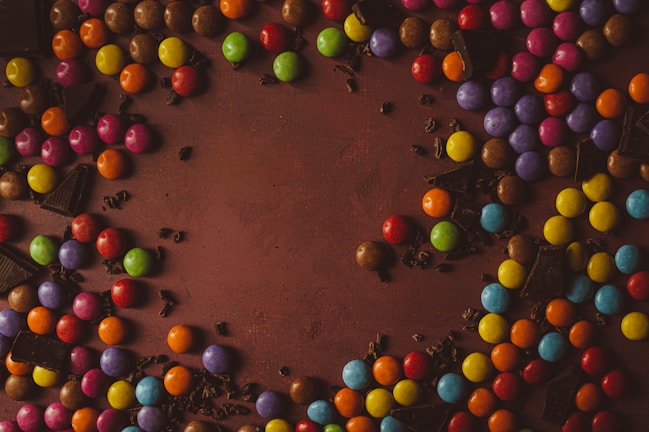 a chocolate cake topped with lots of colorful candies
