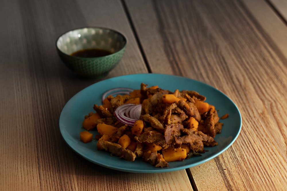 a plate of food on a wooden table