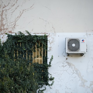 a air conditioner mounted to the side of a building