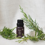 Close-up of handcrafted natural body splash bottles with hazelnut and moss green labels