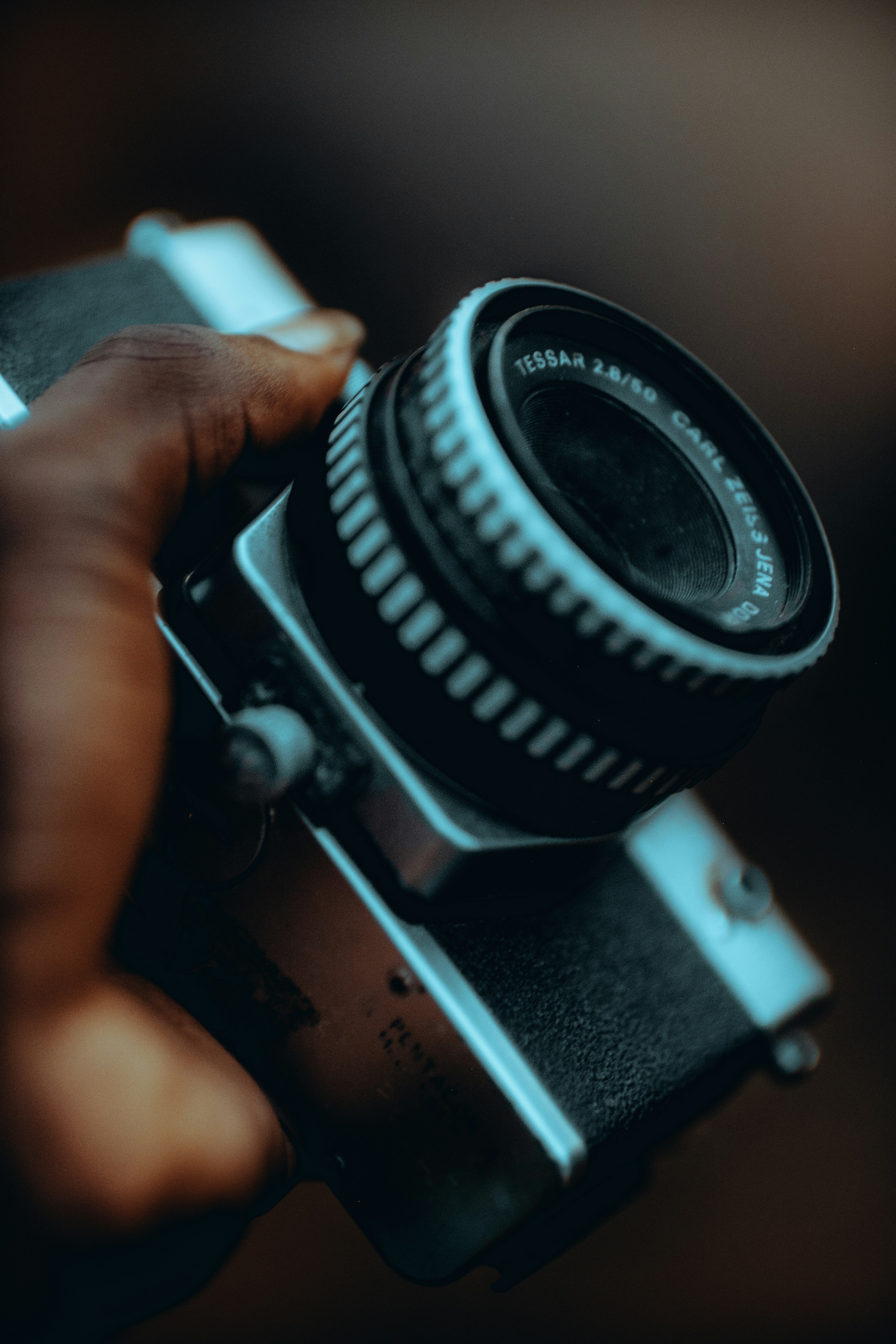 a person holding a camera in their hand