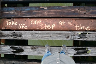 a person with their feet up on a bench
