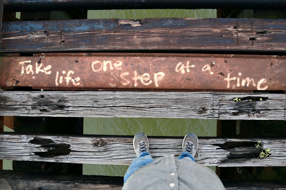 a person with their feet up on a bench