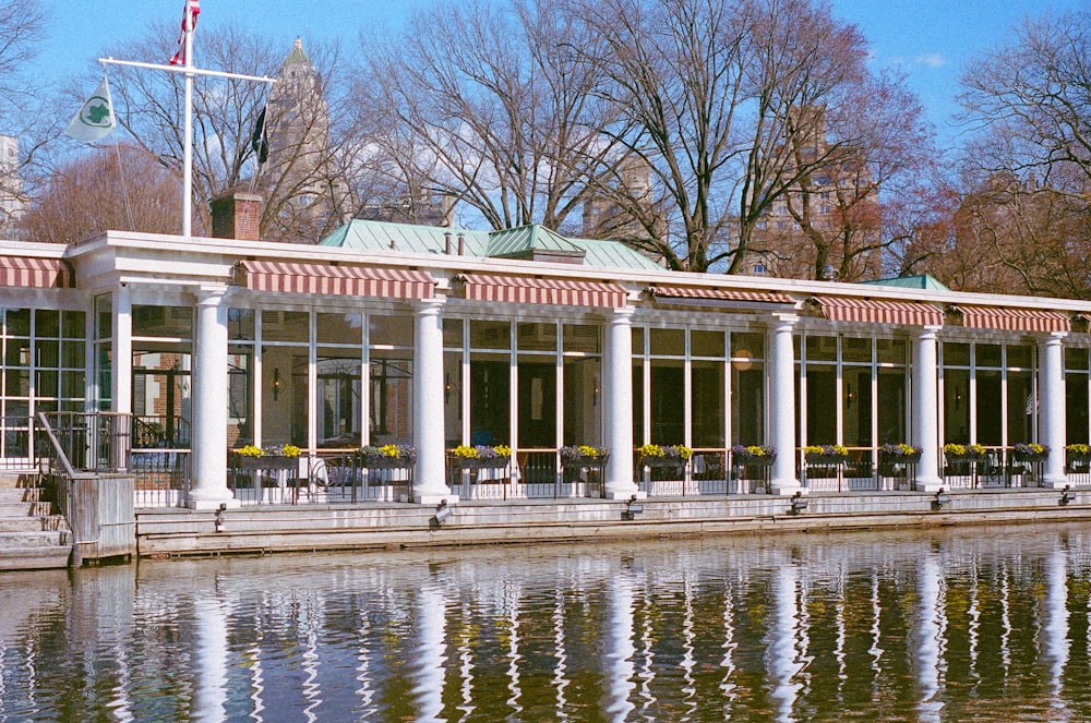 a building sitting next to a body of water