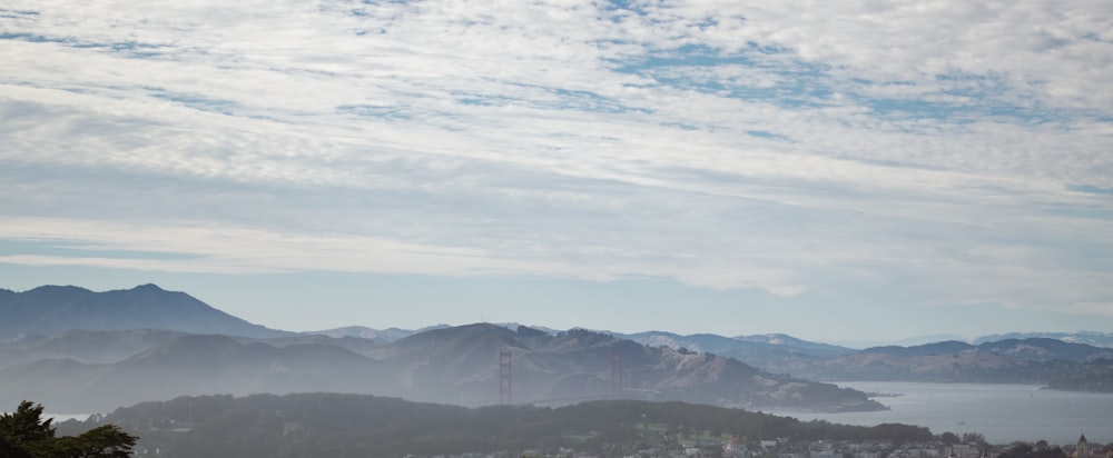 a view of a city with mountains in the background