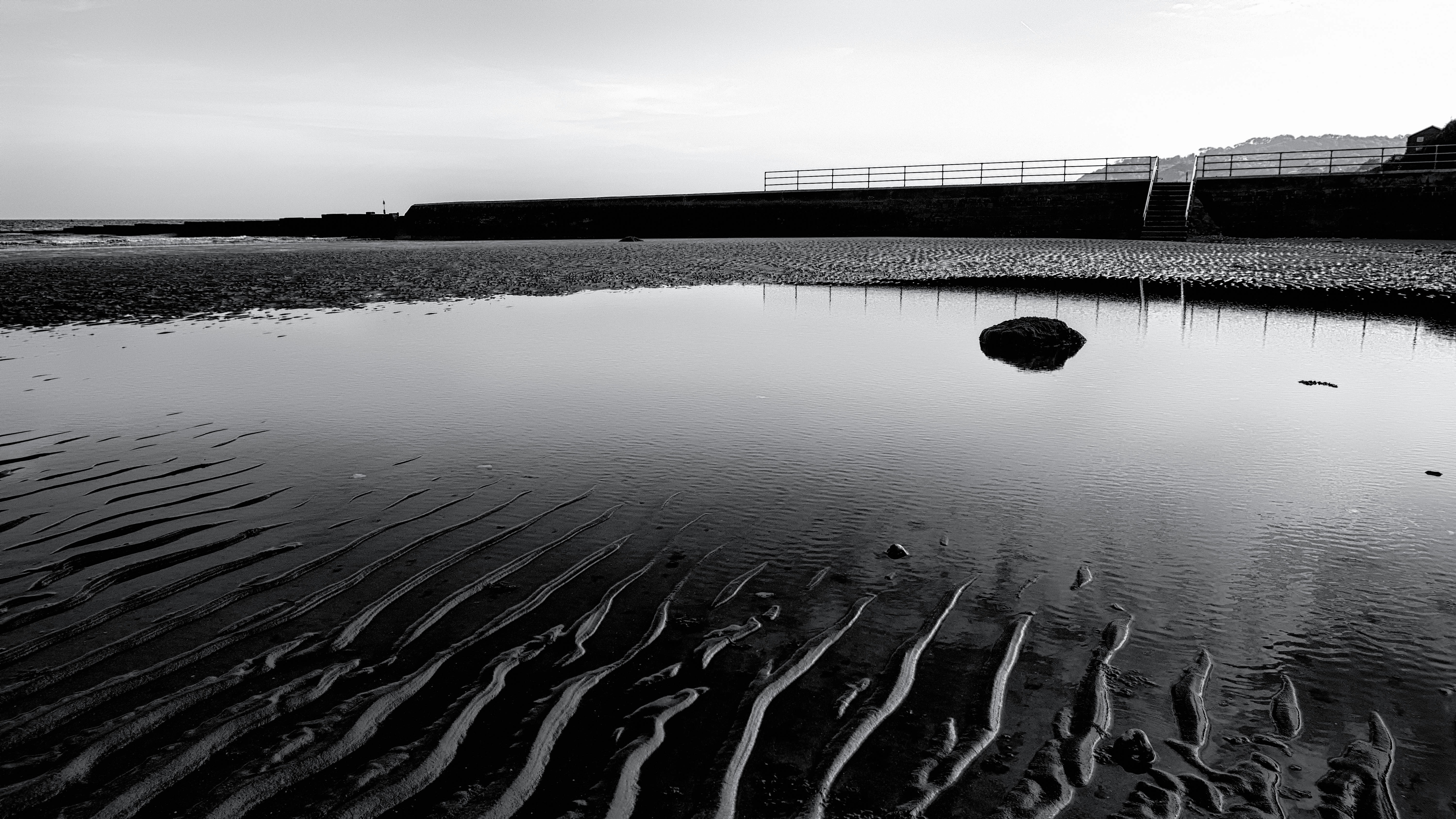 a black and white photo of a body of water