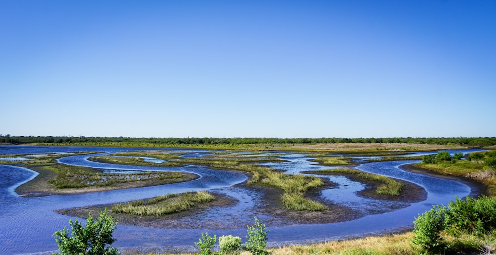 a view of a body of water surrounded by land