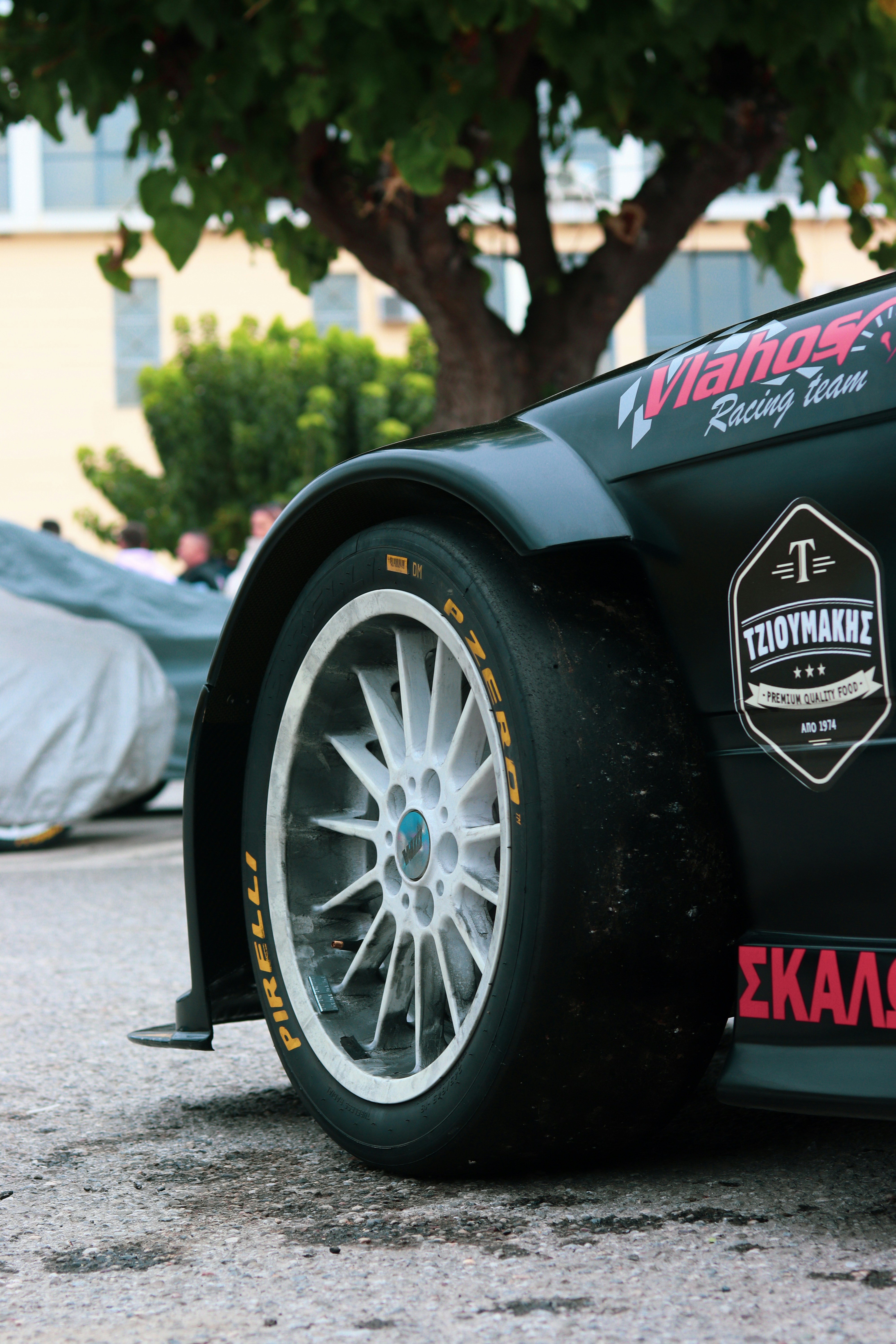 a close up of a race car on a street