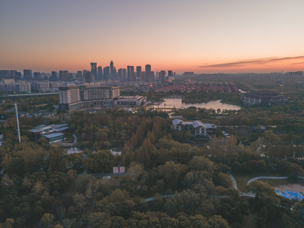 an aerial view of a city at sunset