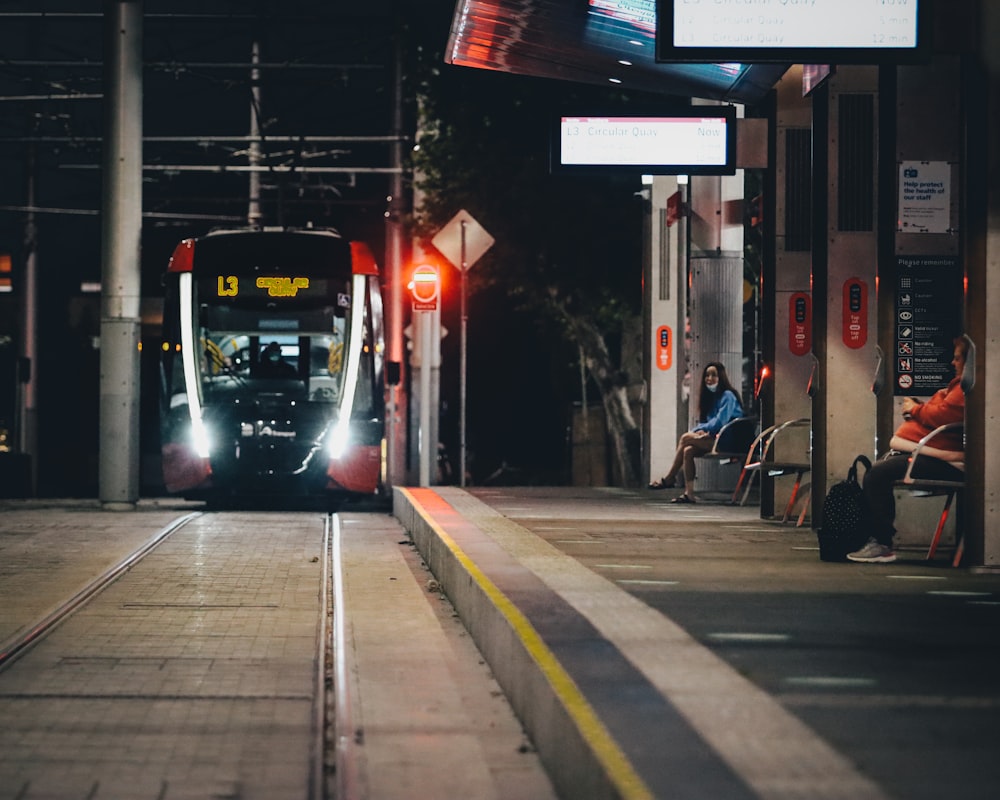 a train is coming down the tracks at night