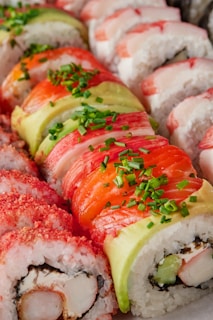 a platter of sushi with various toppings