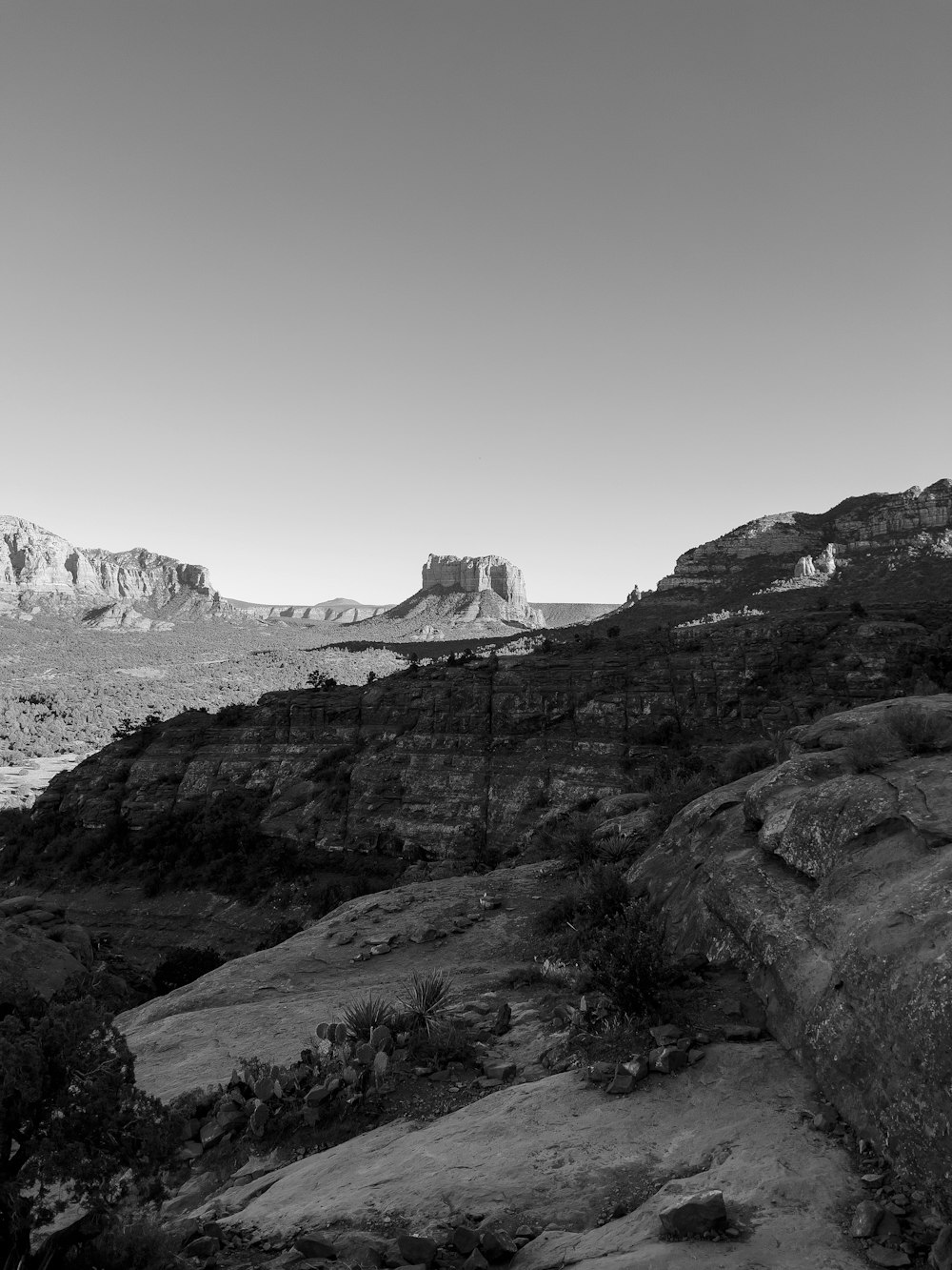 a black and white photo of a mountain range