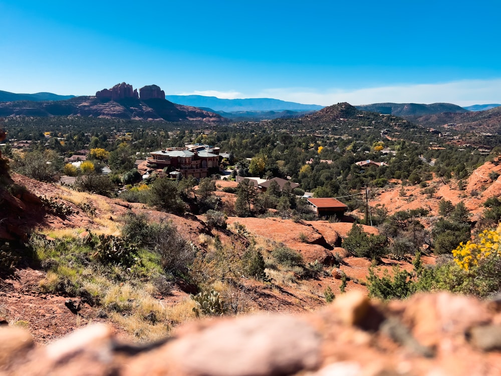 a scenic view of a small town in the mountains