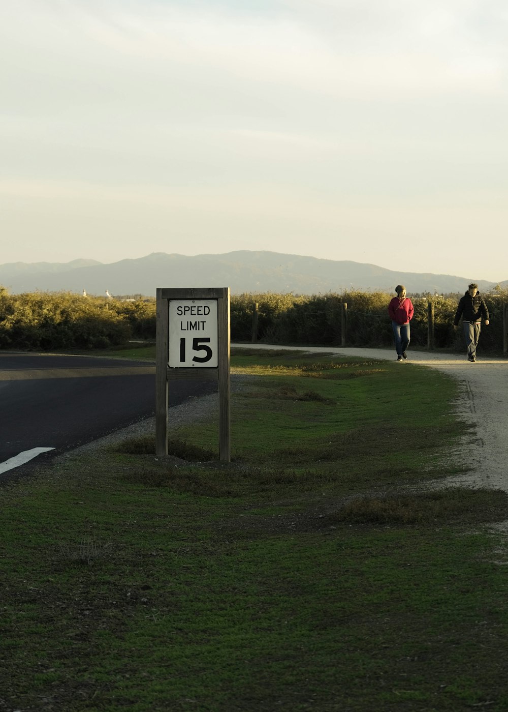 a couple of people that are walking down a road