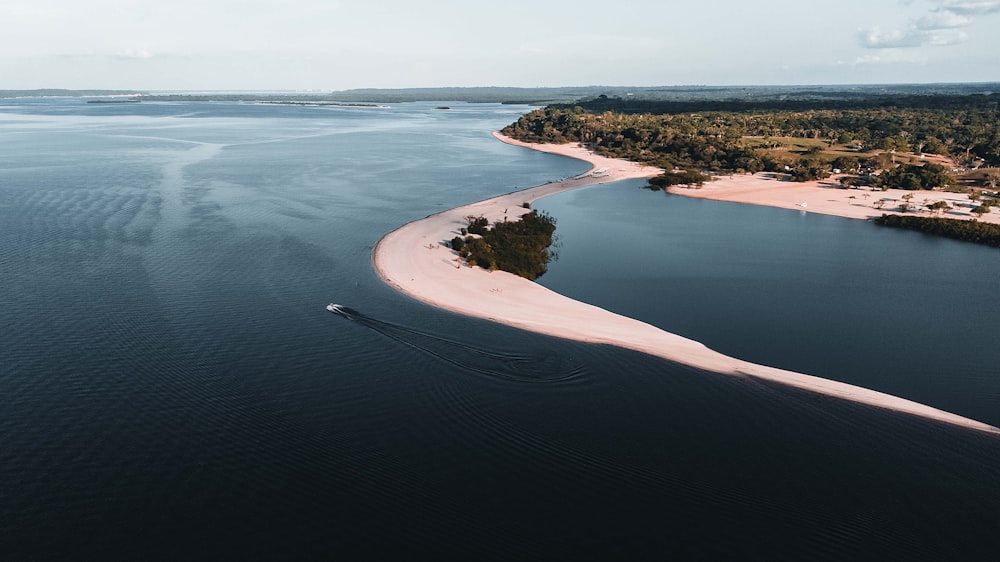 an aerial view of an island in the middle of the ocean